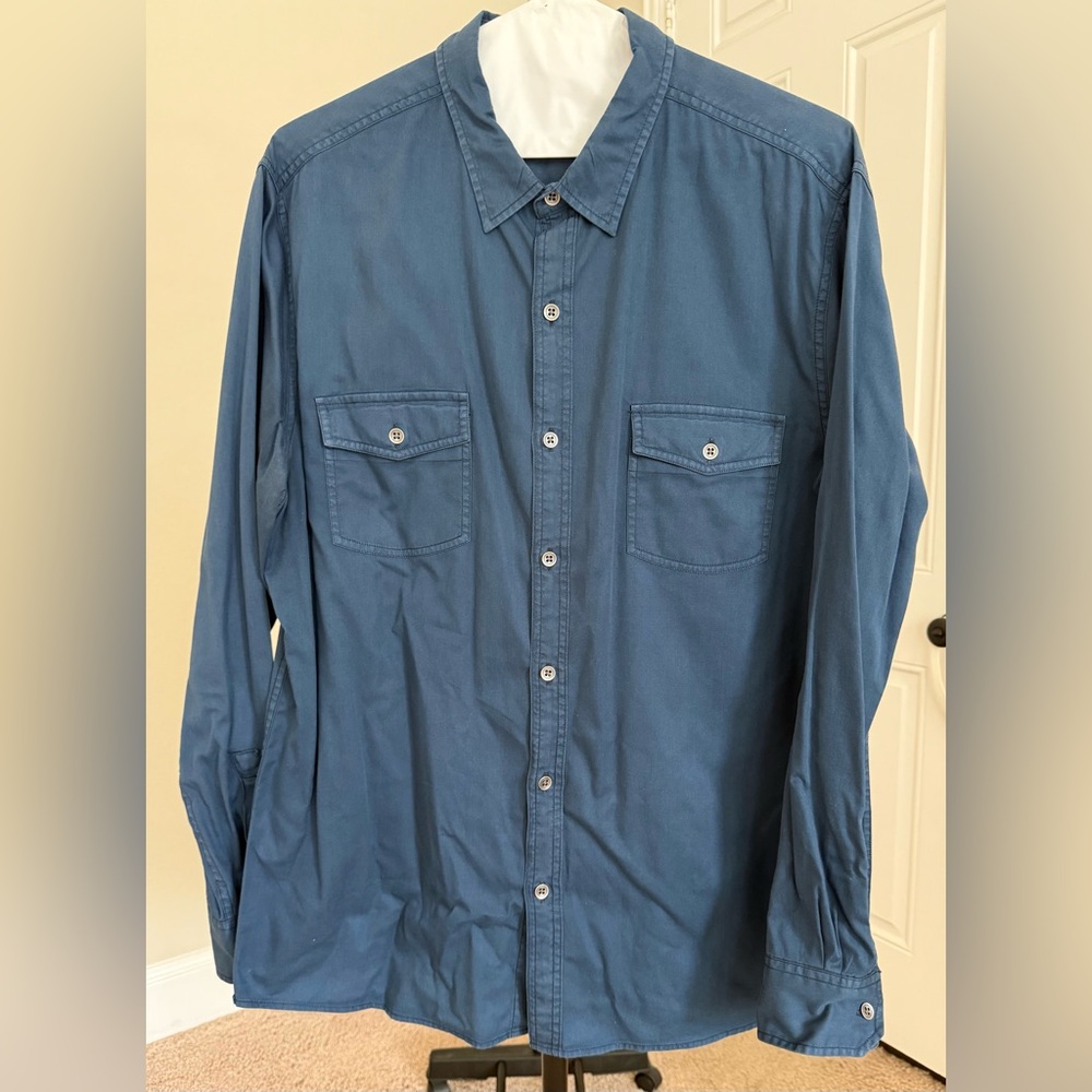 Casual Men's Blue Button-Down Shirt with metal button detail